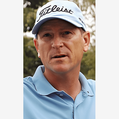 Man wearing a Titleist cap and blue polo shirt outdoors.