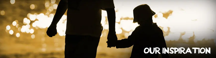Silhouetted adult and child holding hands at sunset.